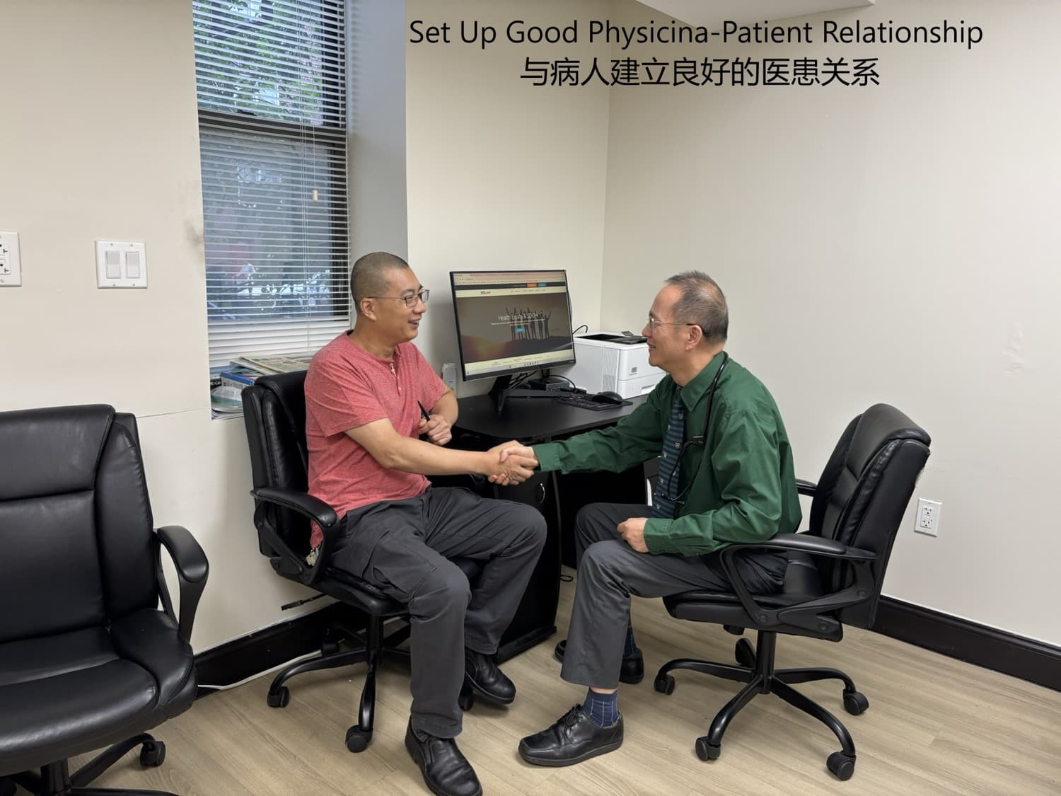 Dr. Lee in a green shirt shaking hands with a seated male patient in the exam room