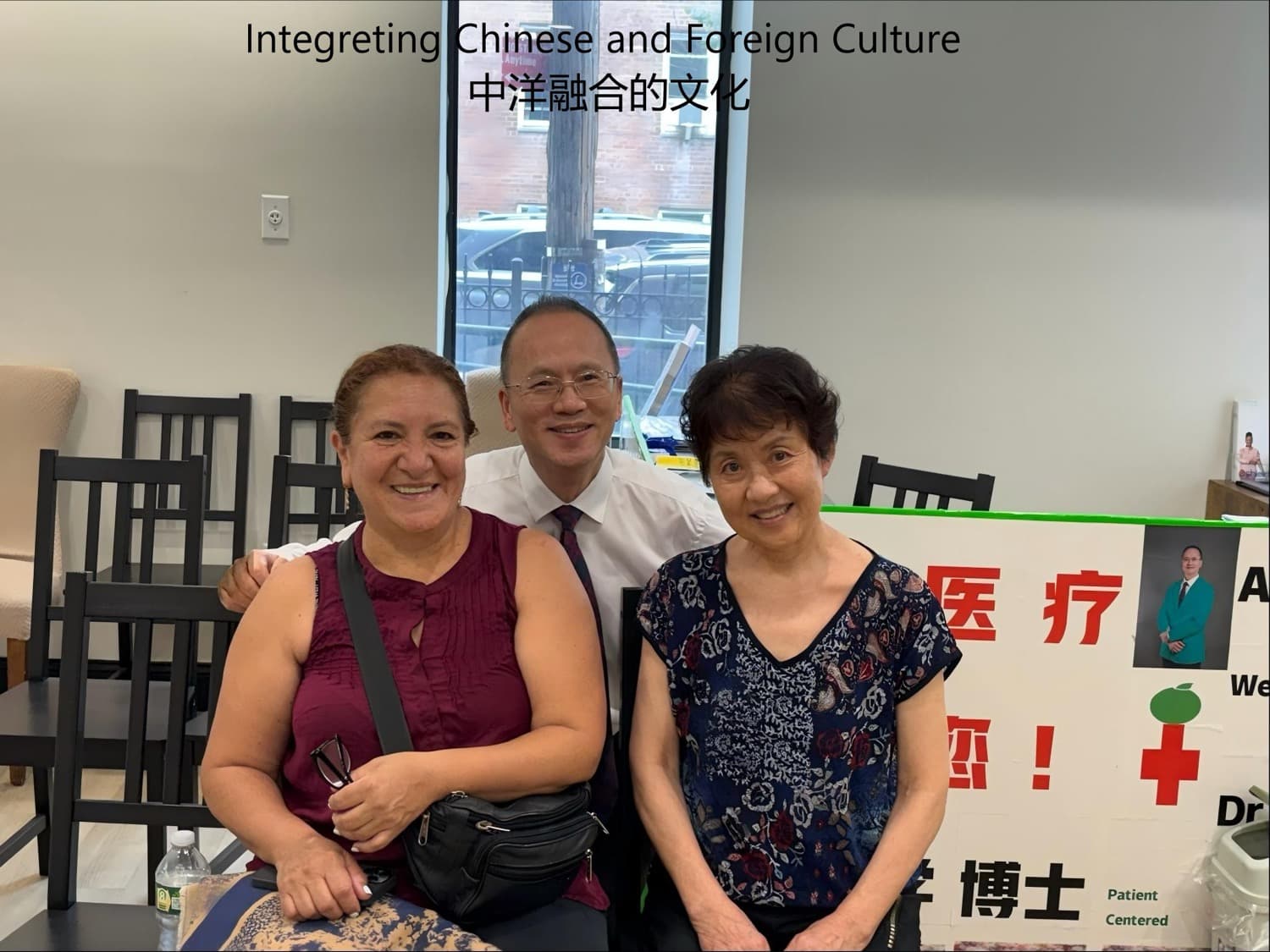 Dr. Lee posing with a Hispanic patient and a Chinese patient